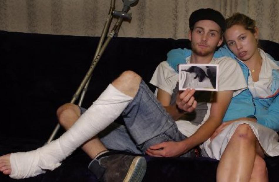 Luke Mathieson and Michaela Evans with a picture of their dog Missy, who was snatched from the...