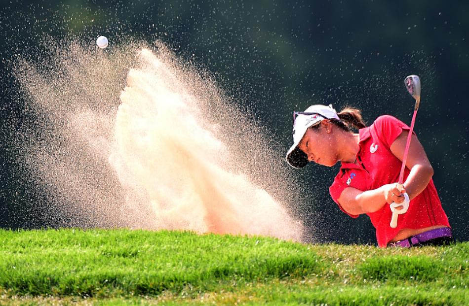 Lydia Ko hits out of a bunker on the fourth hole during the final round. Photo Getty