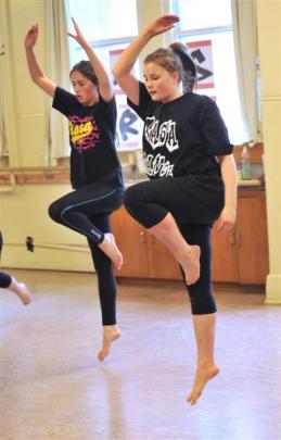 Madeline Seuseu-Mosgrave (15, left) and Samara Marks (14) perform a contemporary dance. Photos by...