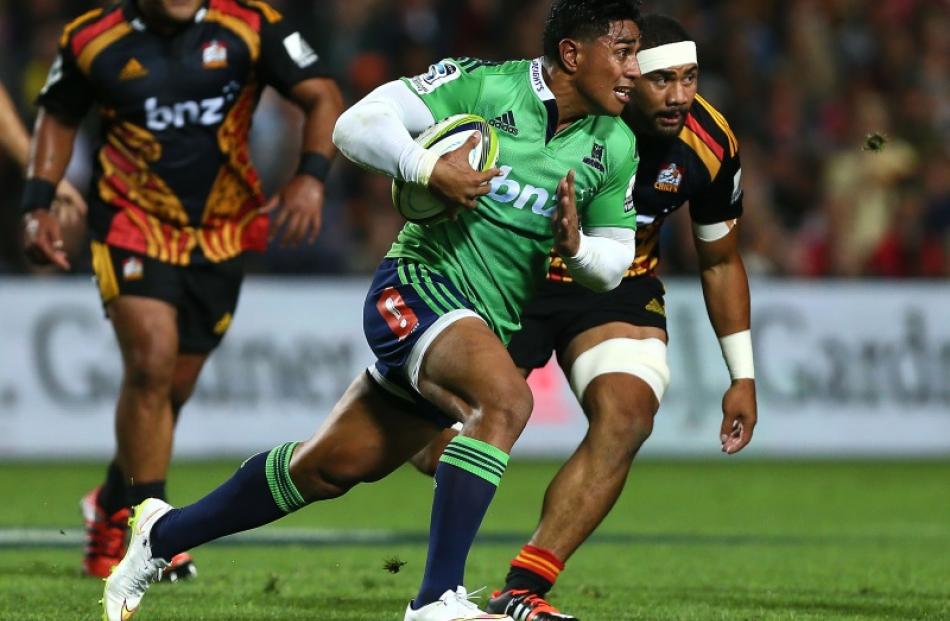 Malakai Fekitoa of the Highlanders makes a break during the round four Super Rugby match between...