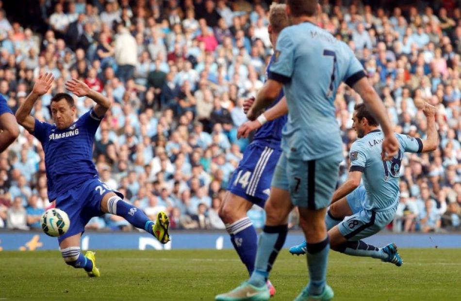 Manchester City's Frank Lampard (R) shoots to score against Chelsea during their match at the...