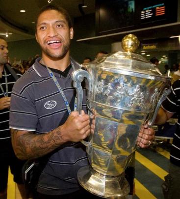 Manu Vatuvei arrives at the Auckland International Airport with the World Cup Sunday. (AP Photo...