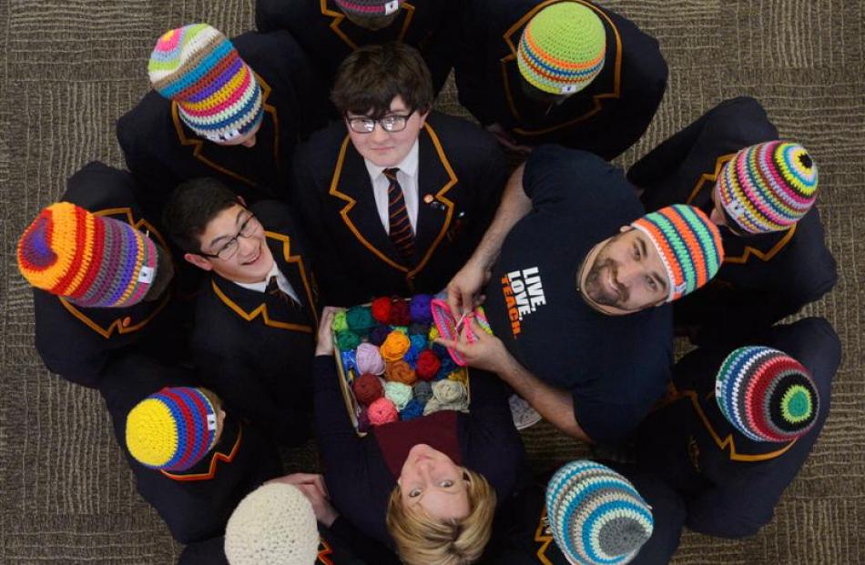 Marcus Schulz (centre, right), of Germany, shows John McGlashan College German teacher Anna Noble...
