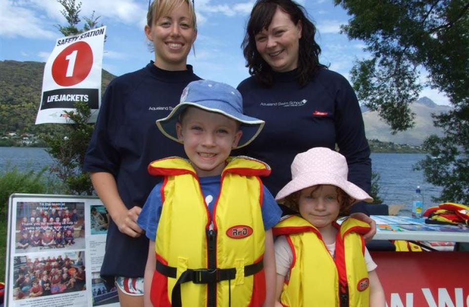 Marie Attridge (left) and Claire George, of Lakes Leisure, help Max (6) and Annika (4) Simpson...