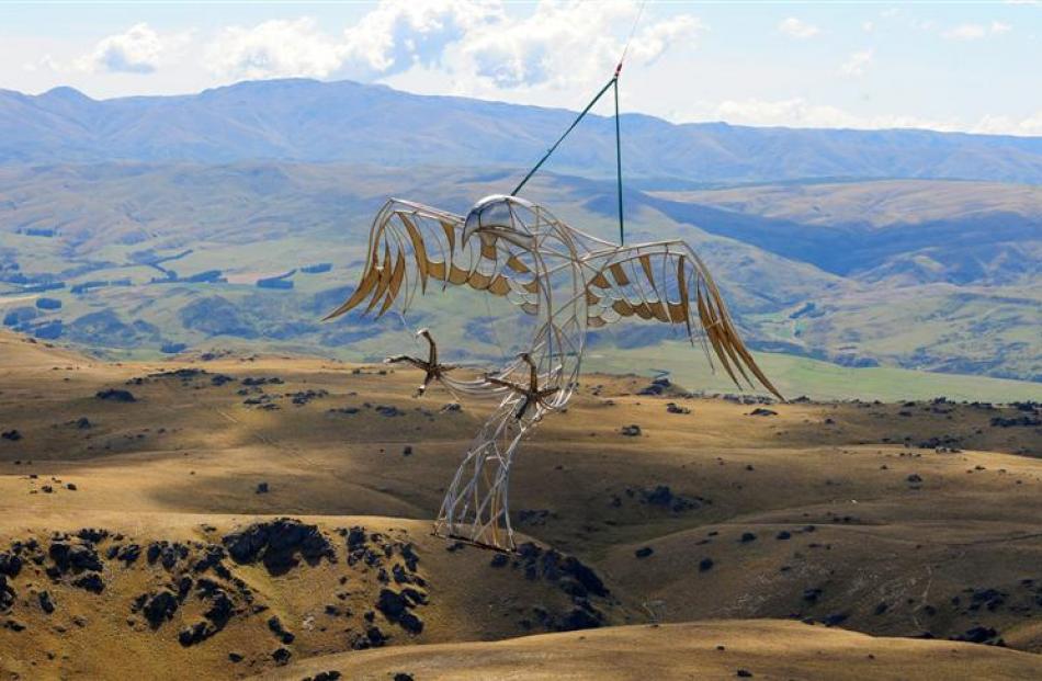 Mark Hill's Haast Eagle sculpture is moved from Arrowtown to Macraes by a helicopter. Photo by...