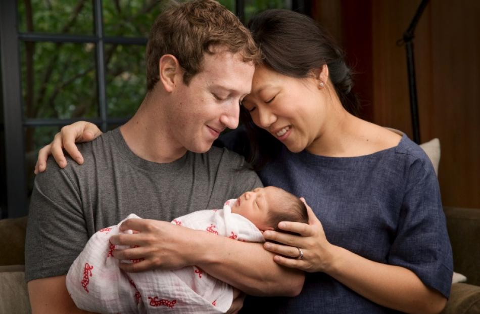 Mark Zuckerberg and wife Priscilla with their daughter, Max. Photo: Reuters