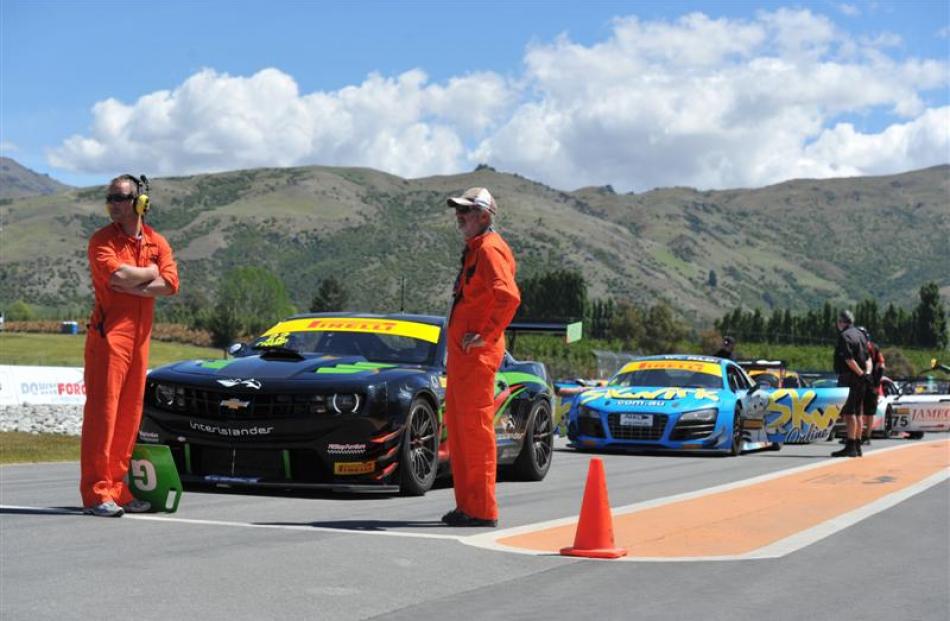 Marshalls wait to let the GT cars  on to the track for an official Highlands 101 practice. First...