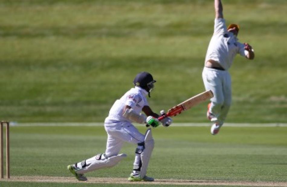 Matt Taylor, of Wellington and New Zealand A, leaps for a ball off the bat of Sri Lanka's...