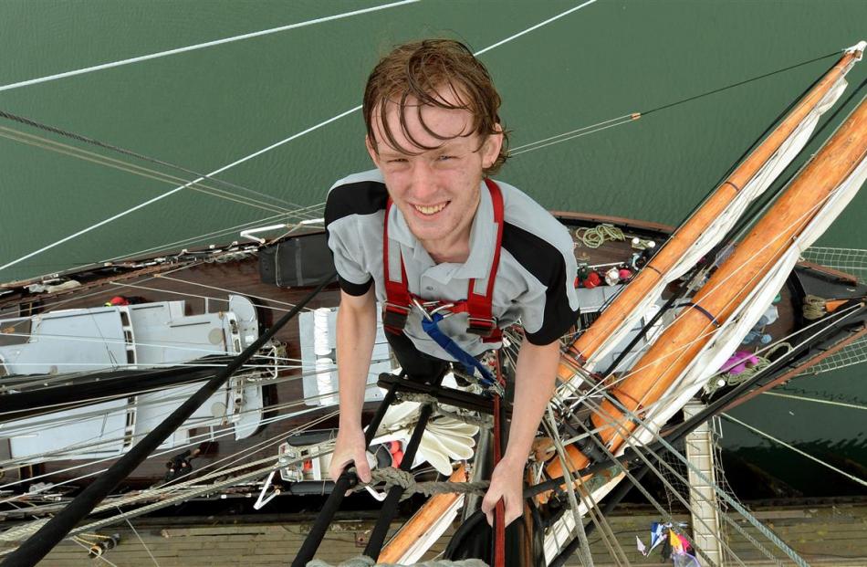 Matthew Smith, of Dunedin, scales the foremast of Spirit of New Zealand during a public open day...