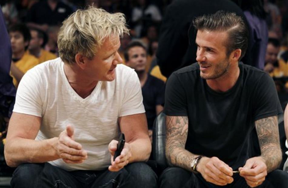 Chef Gordon Ramsay, left, and David Beckham chat before Game 1 of the Los Angeles Lakers v Dallas...