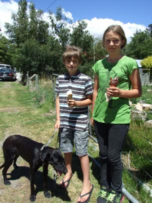 Max (9) and Lucy (11) Lorimer, of Ophir, with their pet Pepper.