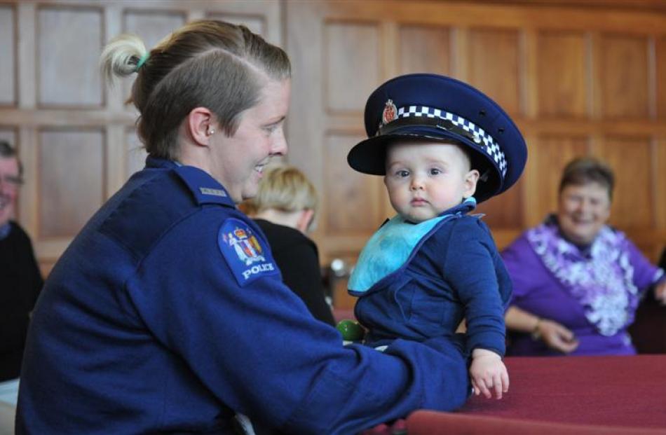 Max Bisset (8 months),  the grandson of Sergeant Kevin Davidson,  wears  Dunedin Constable Lena...