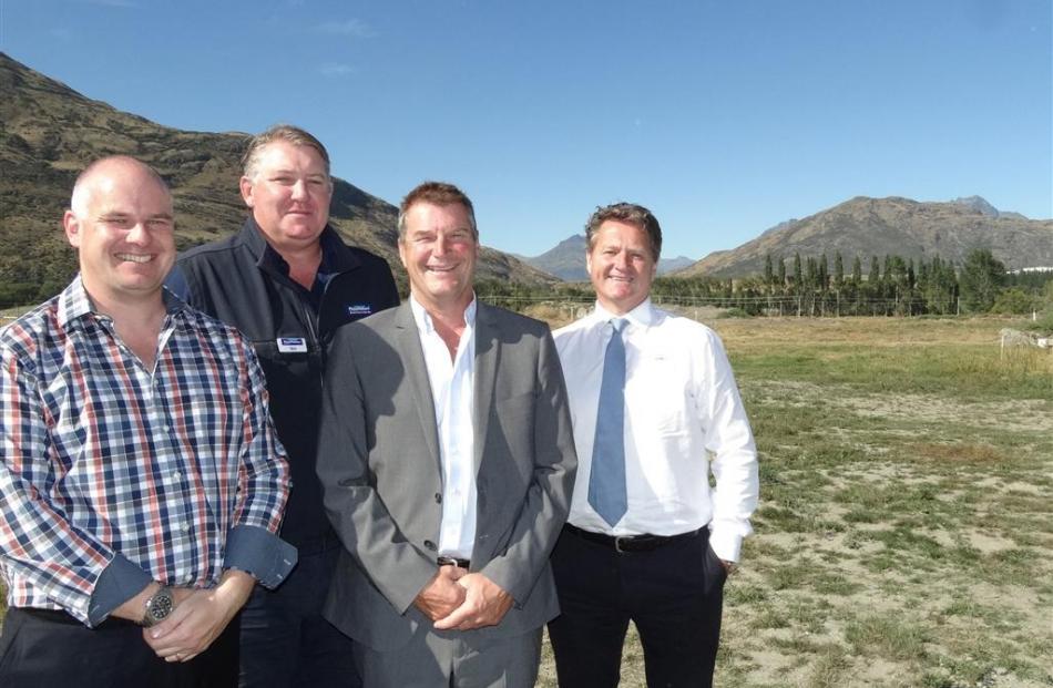 Meeting at the site (right) at the Shotover Country subdivision where a house is to be built as a...