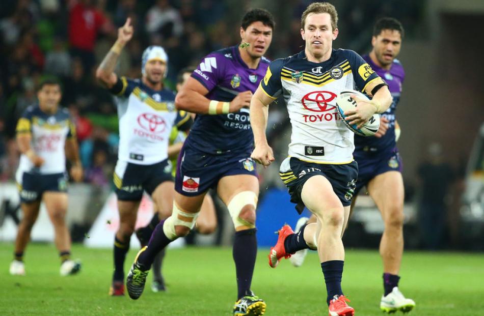 Michael Morgan in the clear for the Cowboys against the Melbourne Storm. Photo: Getty Images.