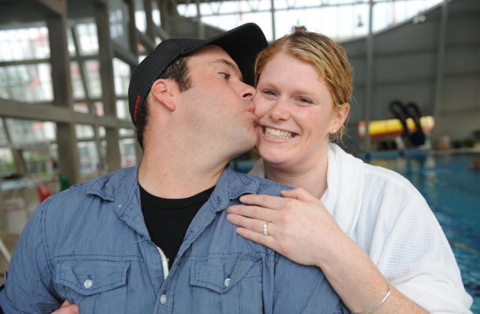 Michael Stevenson kisses partner Rochelle Lord after she jumped from a 7.5m diving board, won a ...