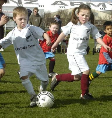 Mitchell Thorn (left), with the ball,  and Zhia Mowat in action during the Otago Daily Times Mini...