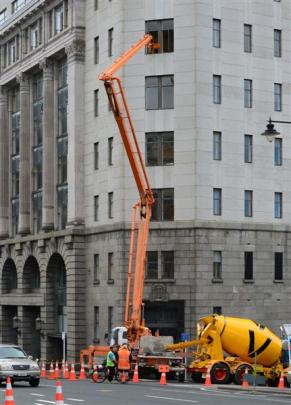 Mixers feeding concrete to the fifth floor of the historic building. Photos by ODT.
