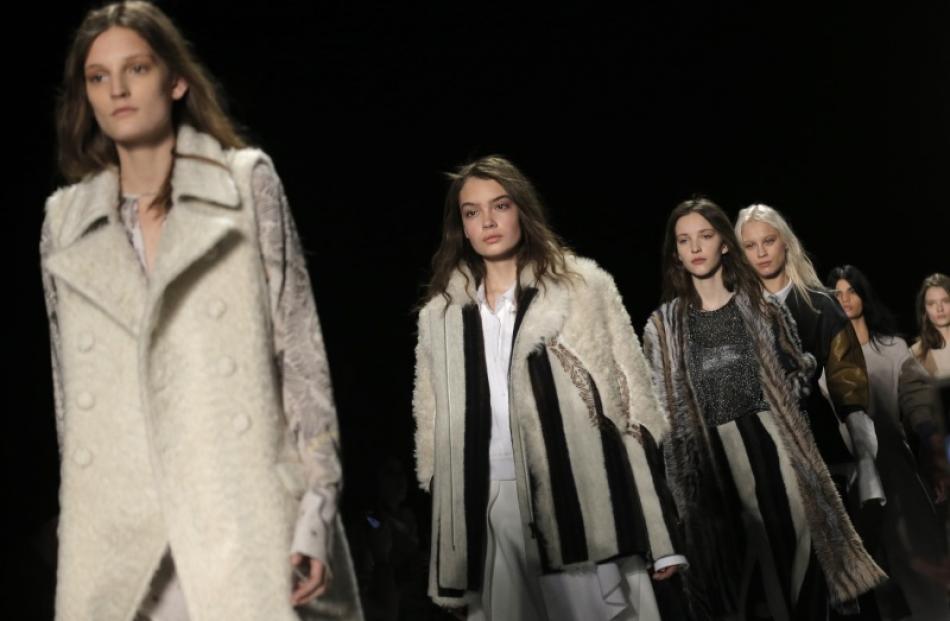 Models present BCBG Max Azria's Fall/Winter 2016 collection at New York Fashion Week. Photos:...