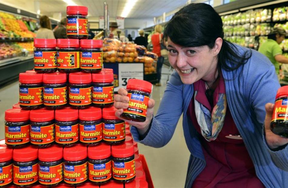 Monique Gallagher picks up a couple of jars of Marmite at Gardens New World yesterday. Photo by...