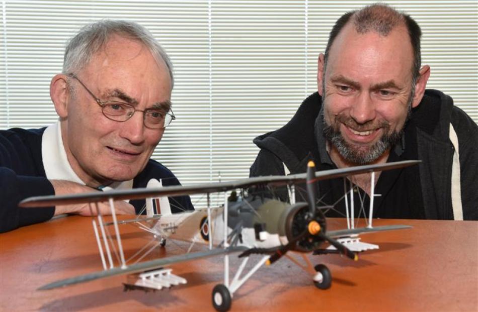 Monsignor Fr John Harrison (left) inspects his Fairey Swordfish model aircraft with International...