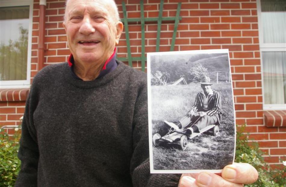 Monster Picnic historian Peter McPherson holds a circa 1930 photograph of Warrack McKenzie riding...