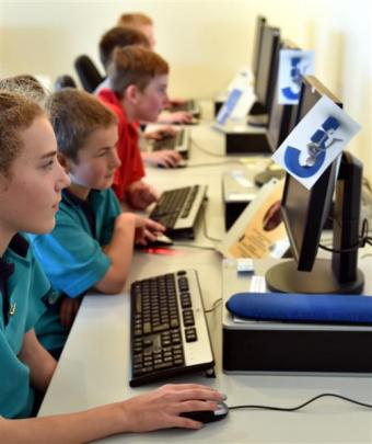 Mosgiel Code Club members (from left) East Taieri School pupils Isabell Gallagher (11) and Logan...