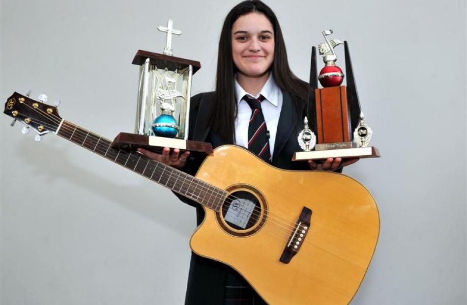 Mosgiel country musician Renee O'Brien shows off some of the awards she won at the Whitestone...