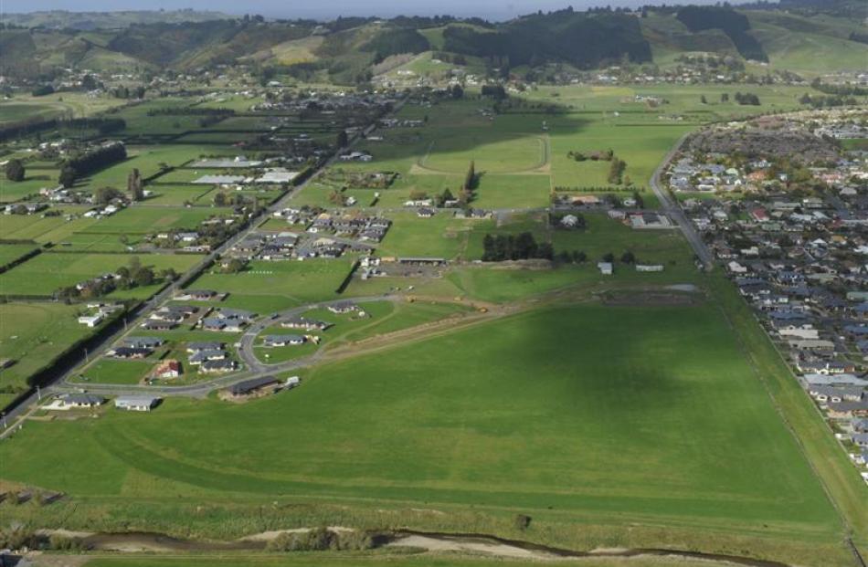 Mosgiel is steadily expanding.  This photograph showing the Silver Springs subdivision was taken...