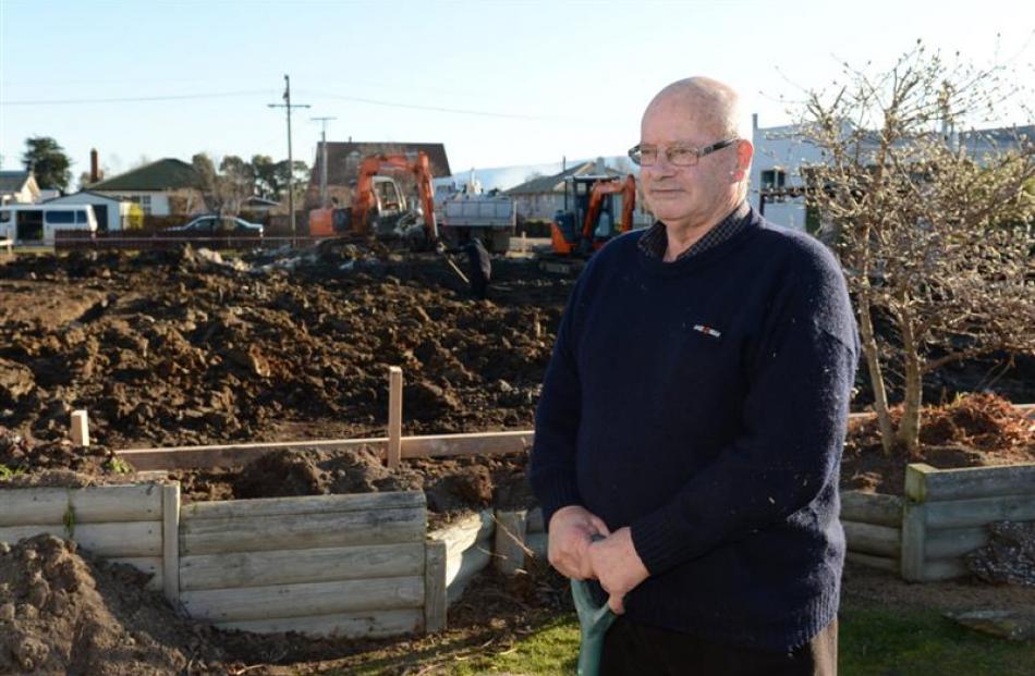 Mosgiel man Andy Bain has lost his fence, and will soon lose part of his garden, after...