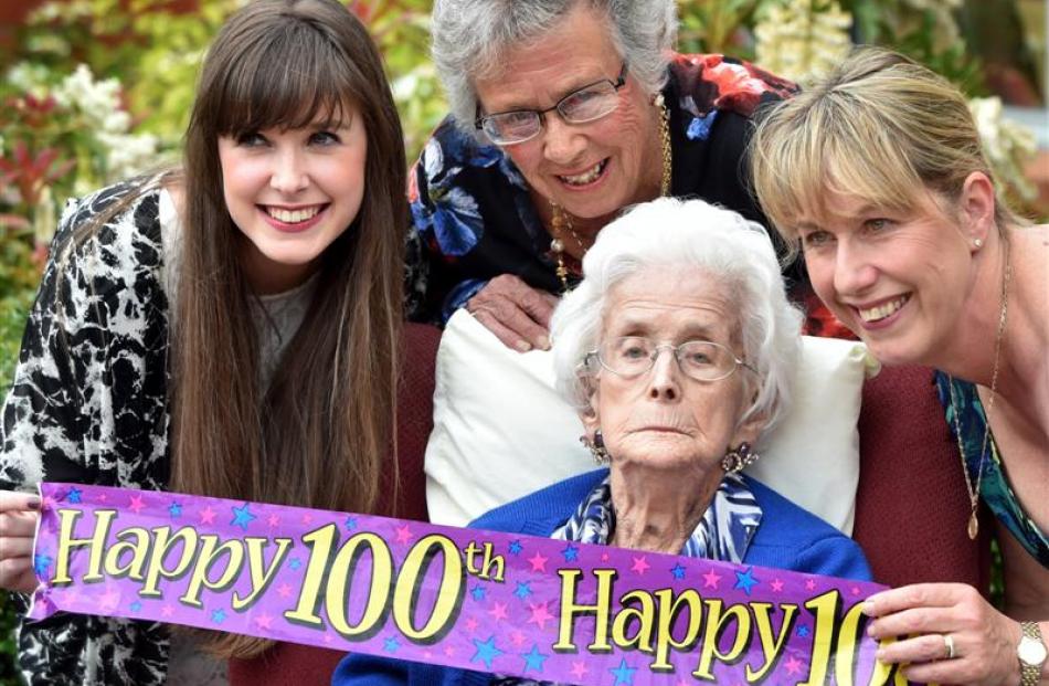 Mossbrae Healthcare resident Fair Graham celebrates her 100th birthday with (from left) great...