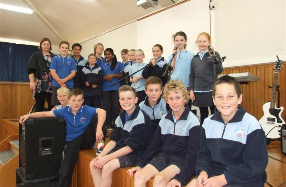 Most of the 27 Queenstown Primary School pupils involved with the school's three rock bands. ...