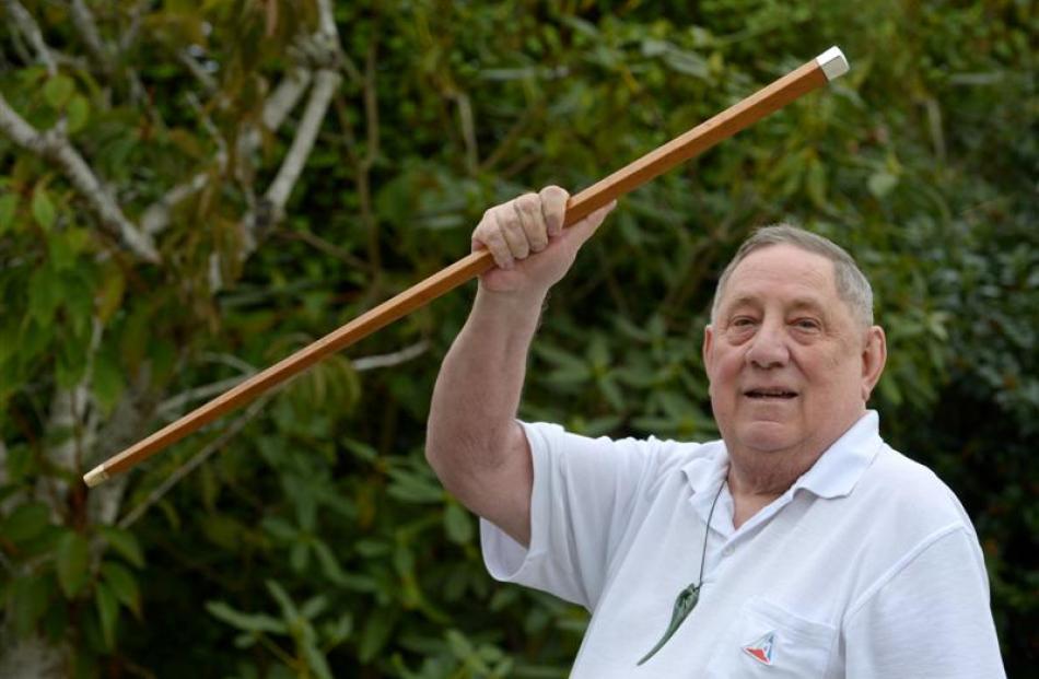 Mr Ellison with the royal cane presented to his grandfather, as featured in the Otago Daily Times...