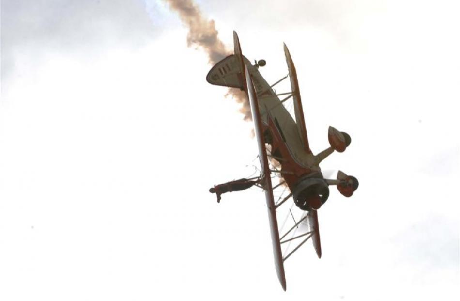 Ms Krainz goes through her paces at the Warbirds Over Wanaka airshow yesterday while Mr Walentin...