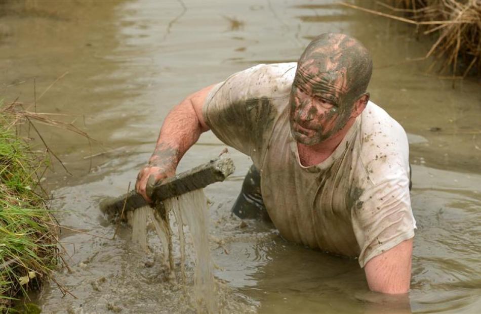 Mud, Sweat and Tears Challenge organiser Russell Lundy gets a taste of the course at Wingatui, as...