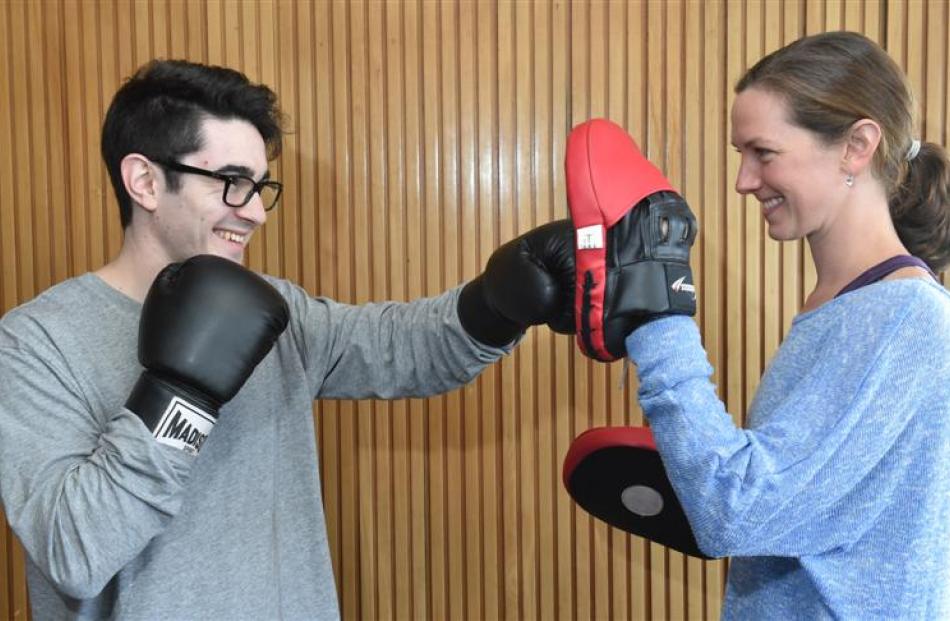 Nathan Hamilton spars with Hannah Grills, the co-ordinator of the BASE Training Camp for job...