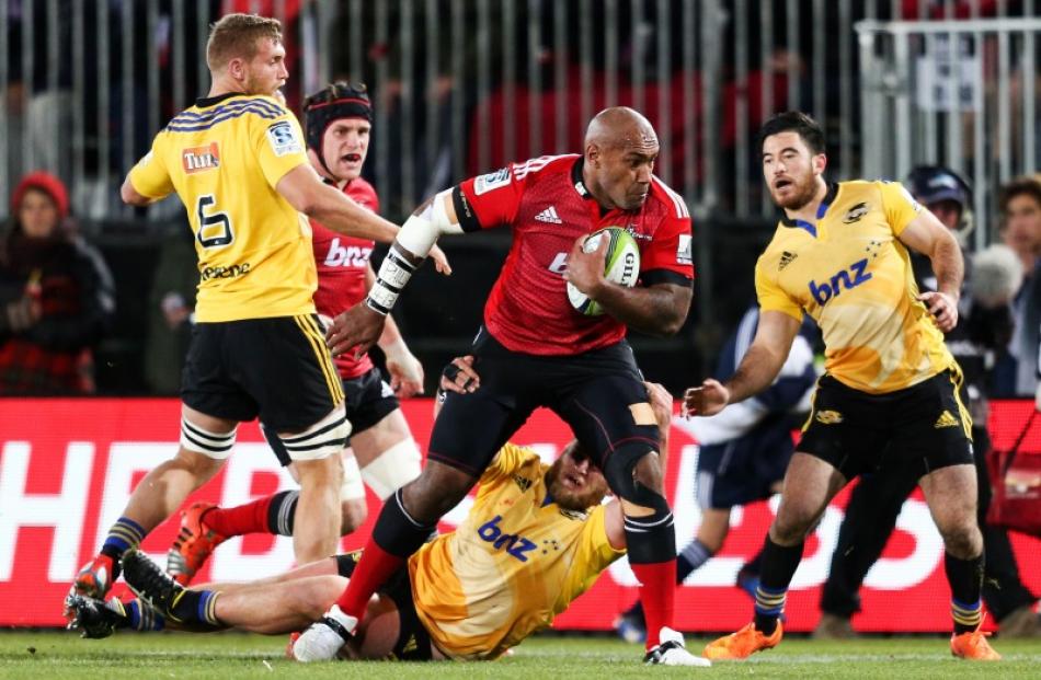 Nemani Nadolo of the Crusaders is tackled during the round 16 Super Rugby match between the...