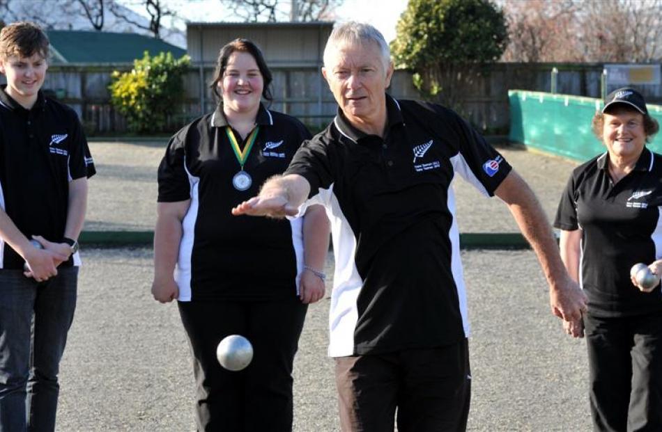 Neville Frost demonstrates his skills while fellow Caversham internationals (from left) Andrew...