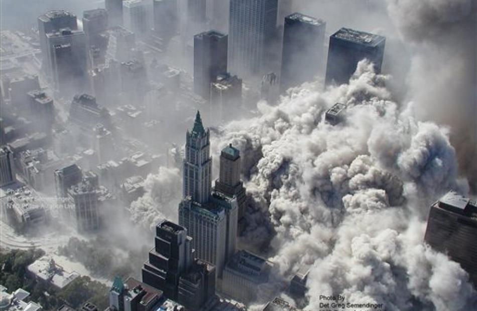 Smoke and ash engulf lower Manhattan after terrorists flew two airliners into the World Trade...