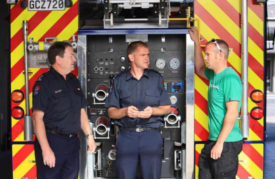 New Zealand Fire Service Central North Otago area manager Keith McIntosh (left), discusses...