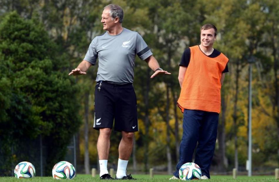 New Zealand Football technical director Rob Sherman hands out some advice to coaches at Logan...