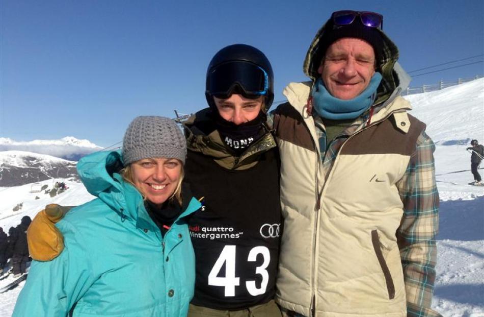 New Zealand snowboarder Carlos Garcia Knight with his parents, Jackie and Javi, on the opening...
