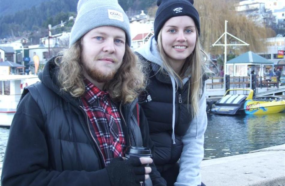 New Zealanders Brook Miller and Brittany Hart relax after arriving in Queenstown yesterday from...