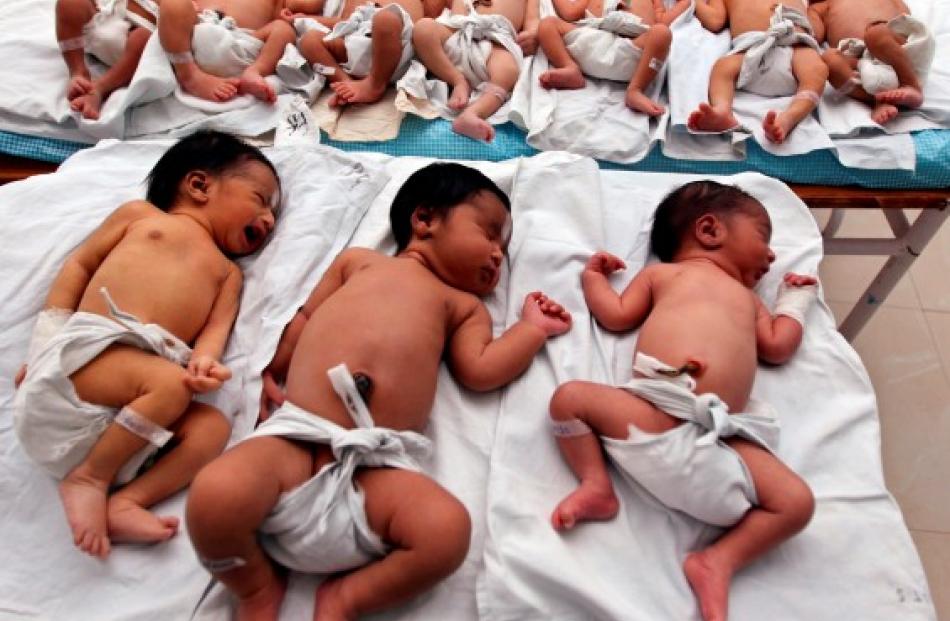 Newborn babies rest inside a hospital ward in the northern Indian city of Lucknow. REUTERS/Pawan...