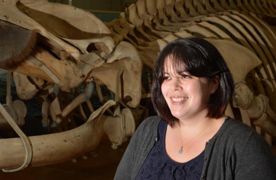 Newly appointed Otago Museum conservation manager Nyssa Mildwaters stands beside a 17m-long fin...