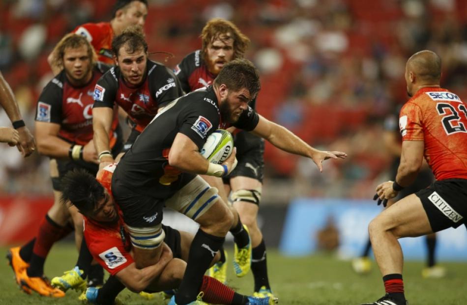 Nick de Jager of the Bulls is tackled during their win over the Sunwolves. Photo: Reuters