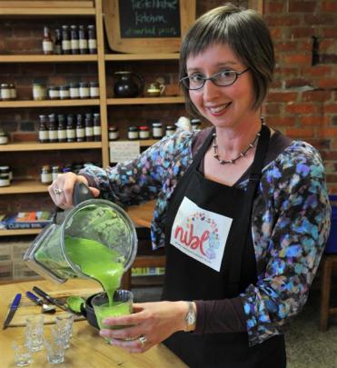 Nicola Brown makes a green smoothie at Taste Nature on High Street. Photo by ODT.