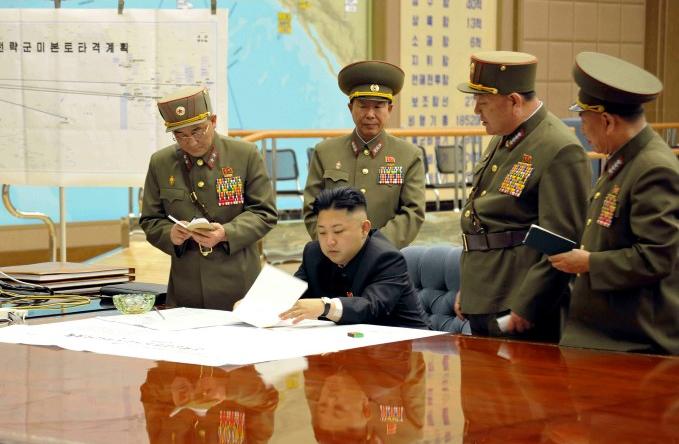 North Korean leader Kim Jong-un (C) presides over a meeting at the Supreme Command in Pyongyang....