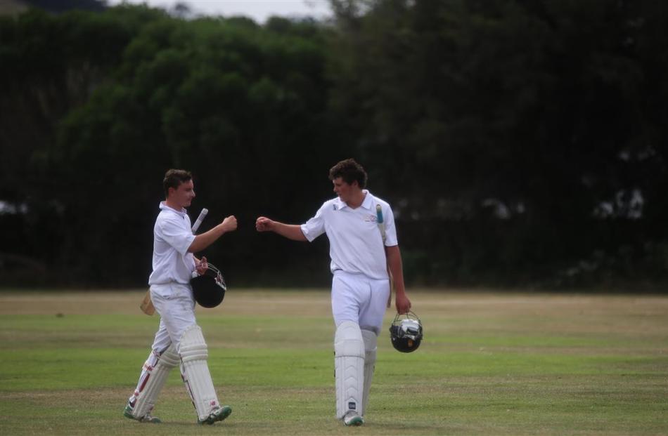 North Otago batsmen Jeremy Smith (left) and Lachie Kingan head off for the tea break during the...