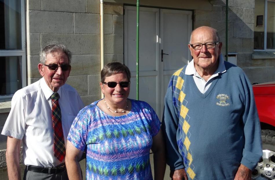 North Otago Highland Pipe Band life member Rex Murray (left), pipe major Janice Hayes, and band...