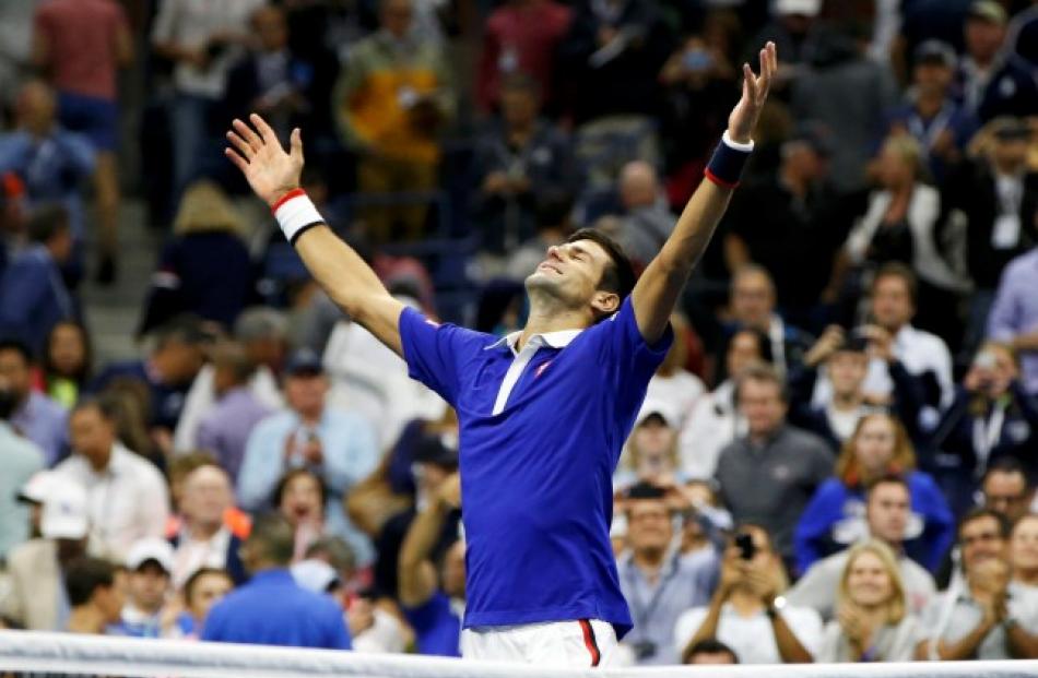 Novak Djokovic celebrates his win over Roger Federer at the US Open in New York. REUTERS/Shannon...